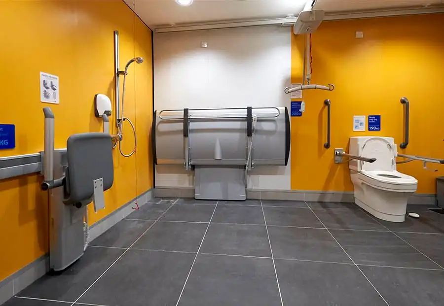 Picture of a Changing Places Toilet, equipped with changing table, hoist and aids and lots of space. 